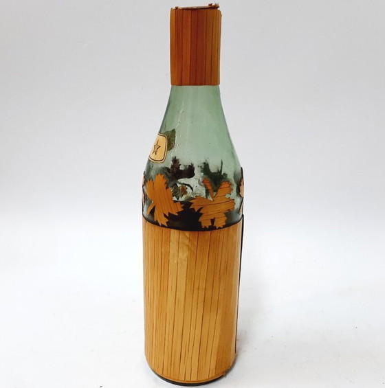 Image 1 of Vintage glazen fles omwikkeld met riet