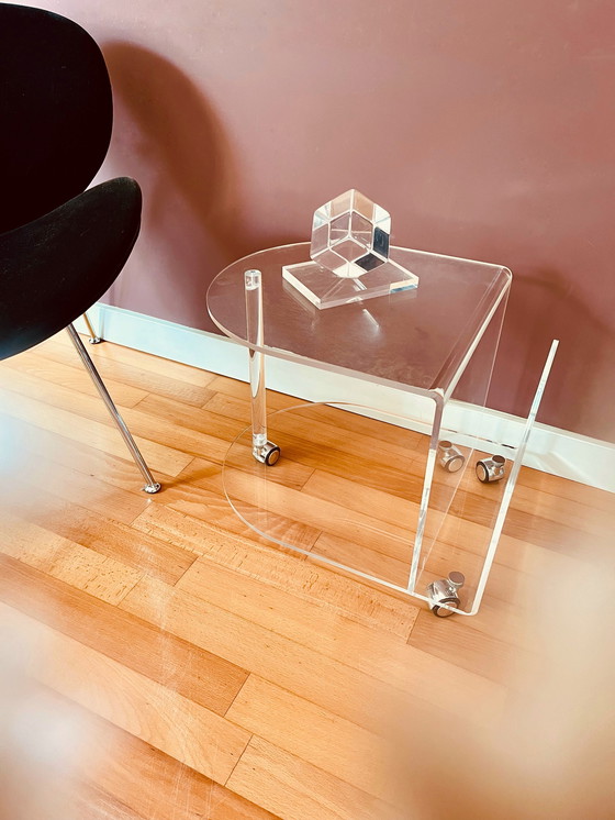 Image 1 of 80's Acrylic side table on wheels + reading material