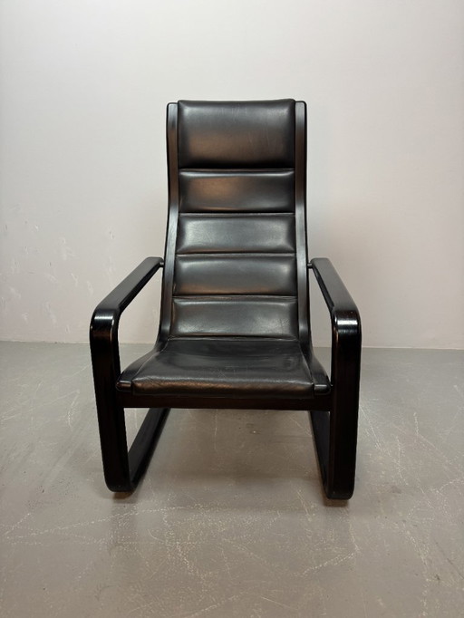 Mid-CenturyDesign Black Leather Lamino Lounge Chair on Black Lacquered Plywood Frame by  Yngve Ekstrom. Denmark, 1970s.