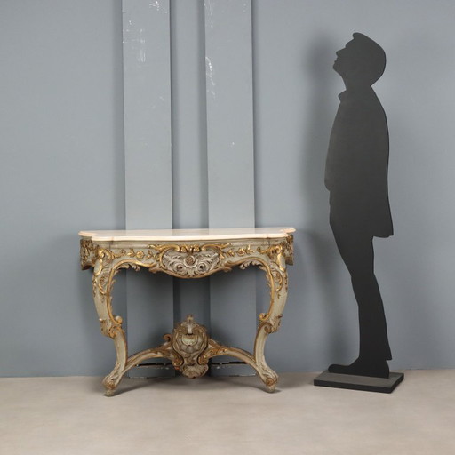 Console table in carved, gilded and lacquered wood