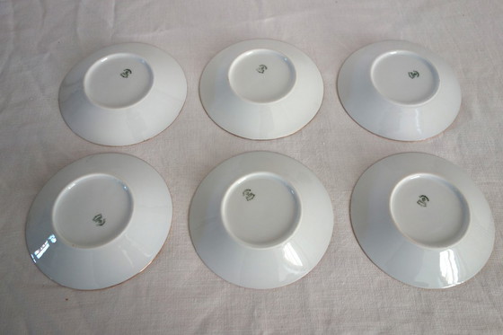 Image 1 of 6 tazas y platillos de Limoges, obra de Robert Haviland, mediados del siglo XX.