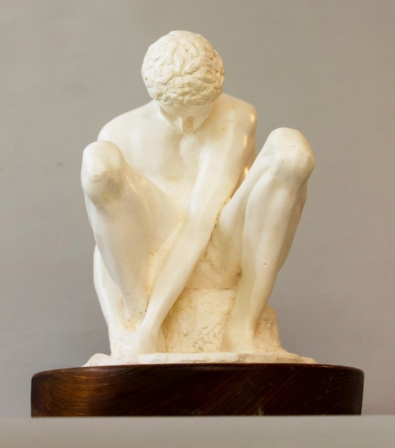 Image 1 of Sculpture of a seated man. Classical male sculpture. Male figure.
