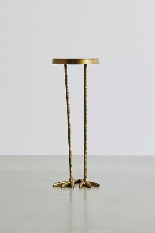 Gold metal side table with bird shape and two bird feet