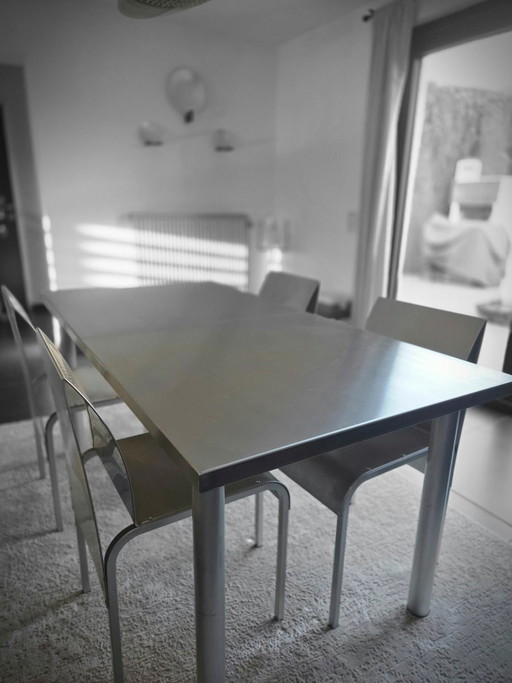 Extendable brushed stainless steel table