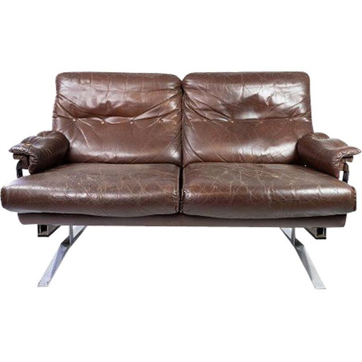 Vintage 2 seater sofa upholstered in brown leather and metal frame by Arne Norell 1970s