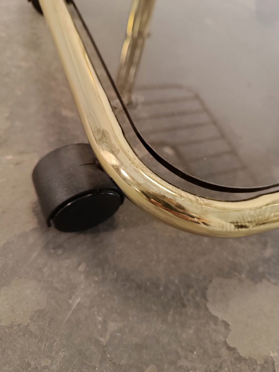 Image 1 of Vintage gold coloured and glass trolley side table 