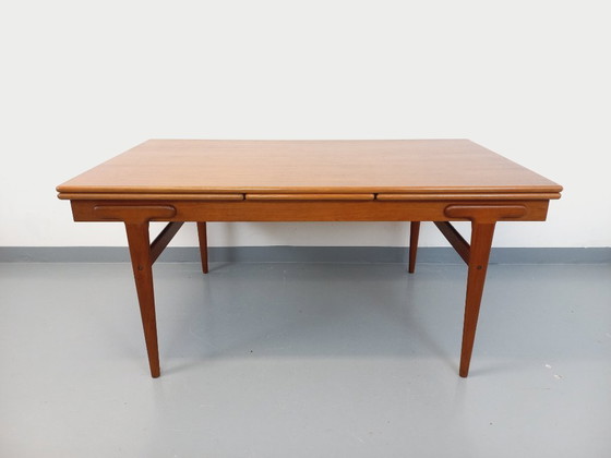 Image 1 of Vintage Scandinavian rectangular dining table by Ejvind A. Johansson from the 50s and 60s in teak with integrated extensions