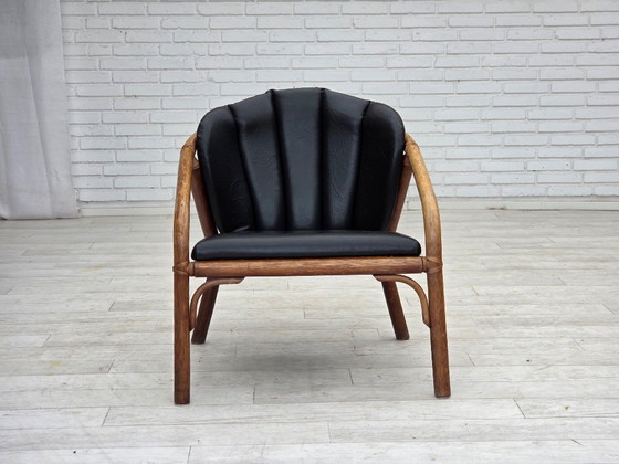 Image 1 of 1970s, Danish armchair, rattan, black artificial leather.