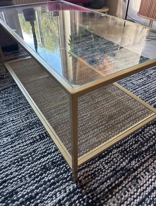 Table basse en verre et métal doré