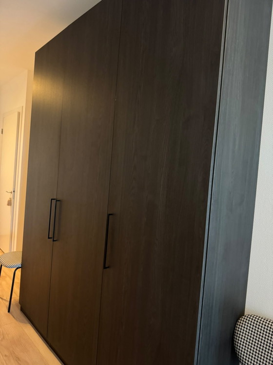 Image 1 of Custom-made wardrobe / clothes cupboard in brown/black wood. 260 high