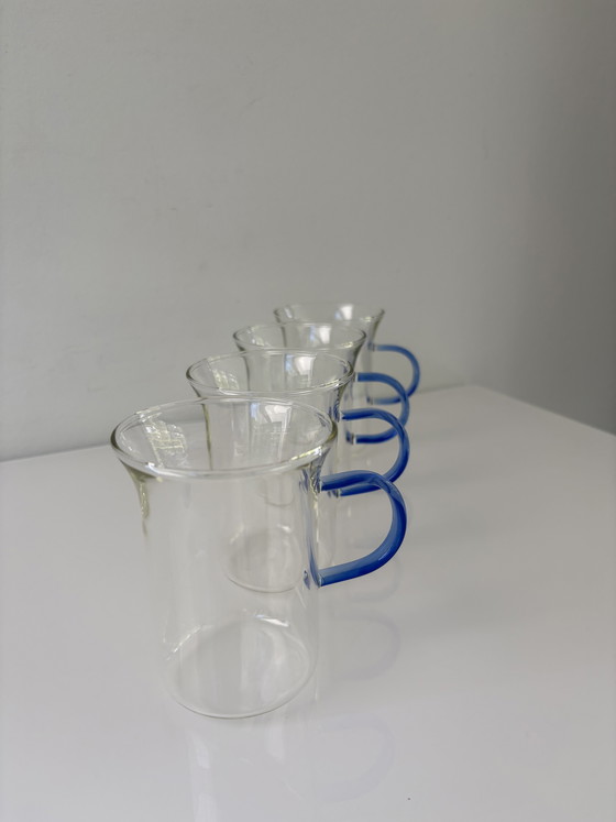 Image 1 of Set of four glass tea mugs with colored handles