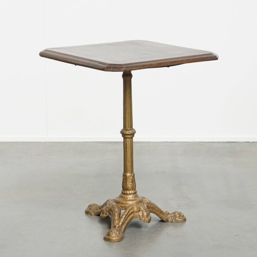 Table de bistrot française ancienne avec pied en fonte dorée et plateau en chêne foncé