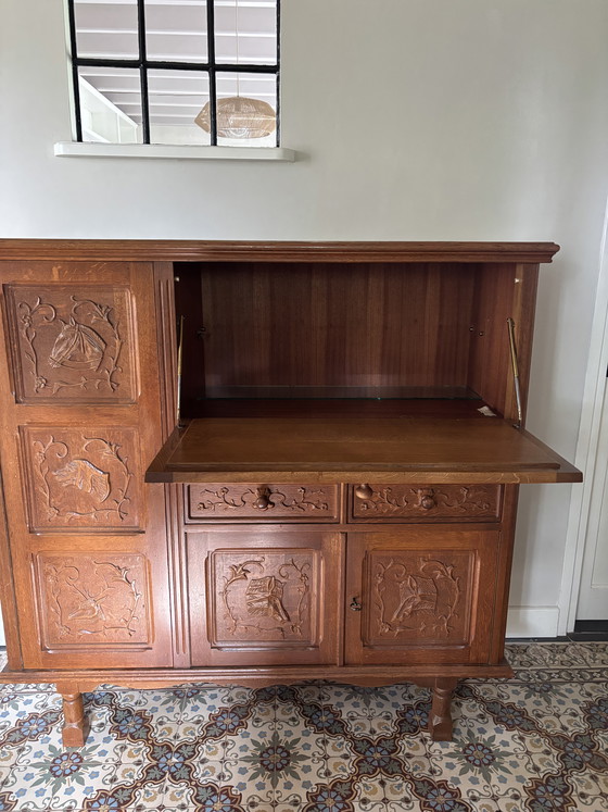 Image 1 of Antique oak secretary hunting cabinet with unique wood carving