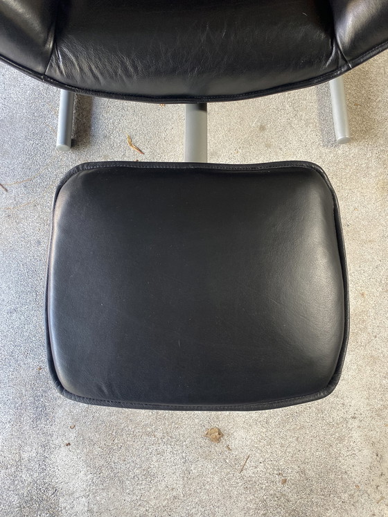 Image 1 of Poltrona Rolf Benz 4100 in pelle nera con poggiapiedi