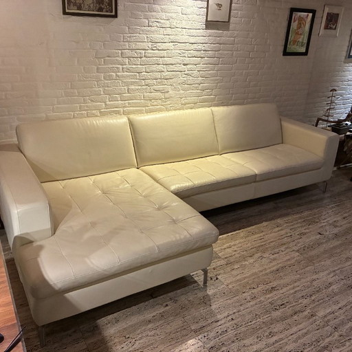 Cream white L-shaped leather Natuzzi sofa with chaise longue