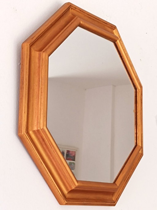 Octagonal wall mirror with gold frame