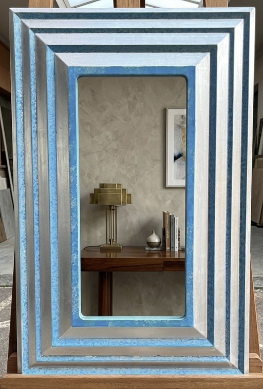 Designer mirror measures 21 x 45 cm, finished size in frame 43 x 67 cm
