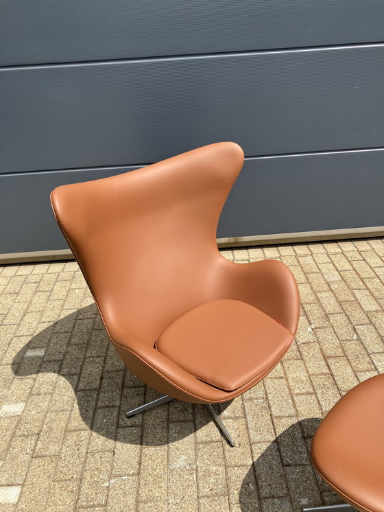 Image 1 of 2x Fritz Hansen Egg Chair + Ottoman en cuir Cognac NEUF !!!