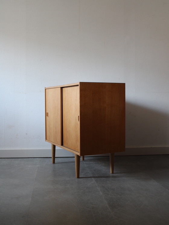 Image 1 of Vintage Danish sliding door cabinet in oak