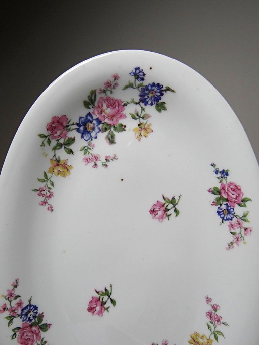 2 Bernardaud porcelain Limoges dishes with floral decoration, 1920s-1950s