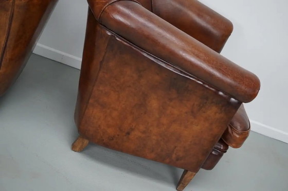 Image 1 of Vintage Nederlandse leren clubfauteuils in cognackleur, set van 2 met voetenbank