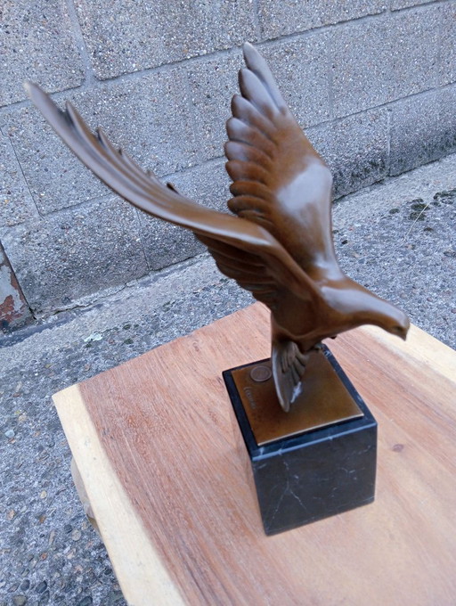 Bronze dove sculpture on marble pedestal