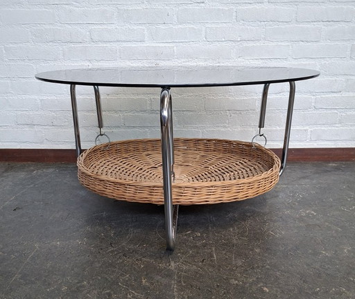vintage round coffee table with glass top and wicker magazine basket