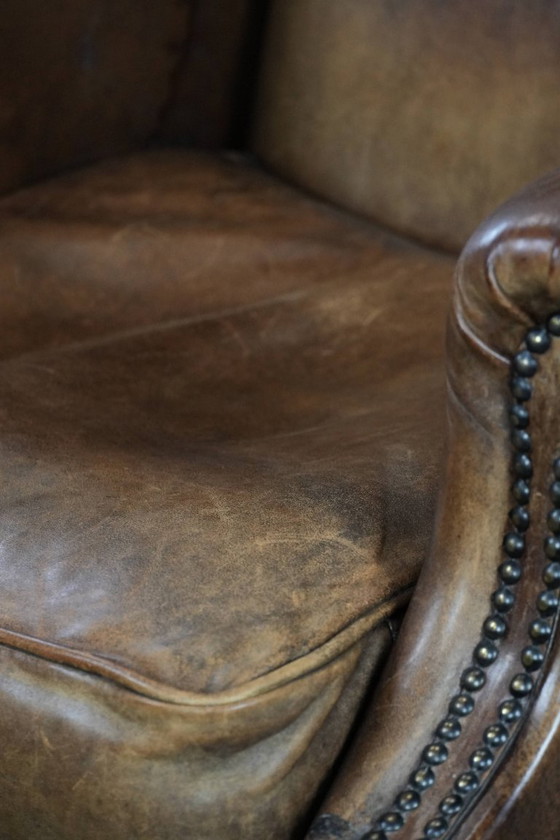 Image 1 of Comfortable vintage sheepskin wing chair with character