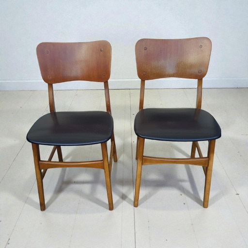 Set di 2 sedie vintage scandinave in teak e similpelle nera, prodotte da Kofod-Larsen, Danimarca, anni '60.