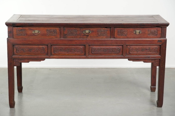 Image 1 of Antique wooden Chinese sideboard from the late 19th century in a beautiful red color with exquisite wood carving.