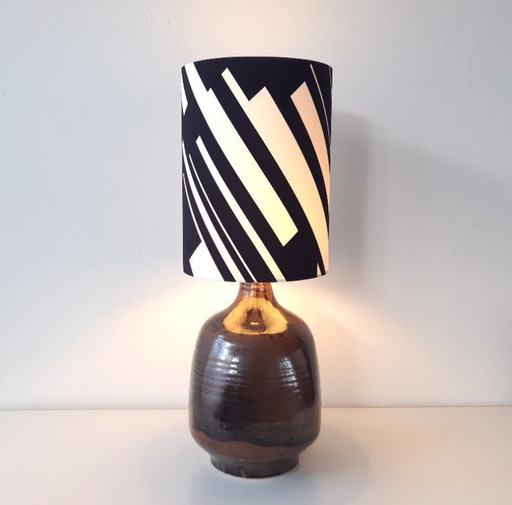 Sturdy dark brown ceramic Rheinfelden lamp base with new handmade lampshade of black and white graphic fabric