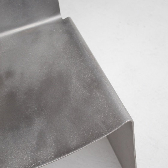 Image 1 of Metalen stoel en bijzettafelset van Xavier Lust