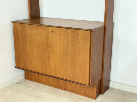 Modular mid-century wall shelf by interna-Peter Pedrides / Teak shelving system 1960s – Shelving unit, Wood (photo 7 of 27)