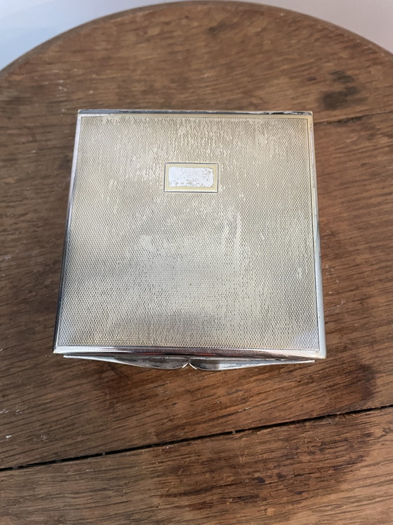 Image 1 of Estuches para cigarrillos y apagavelas, chapados en plata.