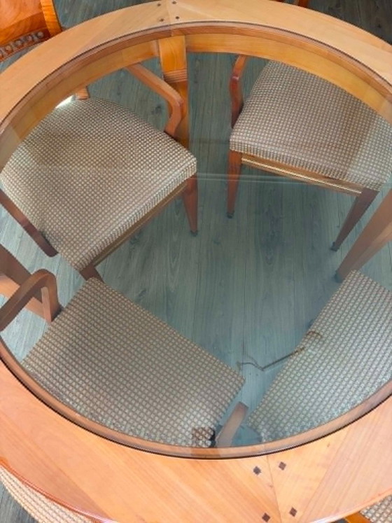 Image 1 of round wooden dining table with glass top and 4 matching chairs