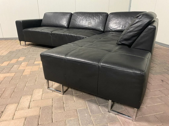 Image 1 of Piet Klerkx zwarte hoekbank van echt leer met comfortabele zitplaatsen en ruime hoek.