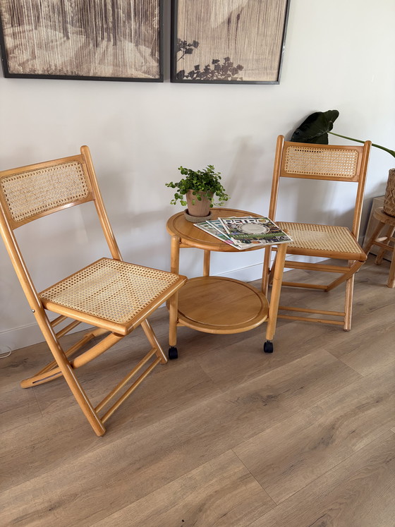 Image 1 of Twee vintage inklapbare houten met webbing stoelen 