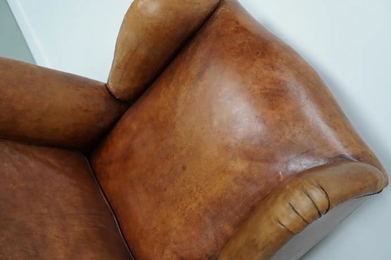 Image 1 of Vintage Nederlandse cognackleurige leren clubfauteuil met voetenbank