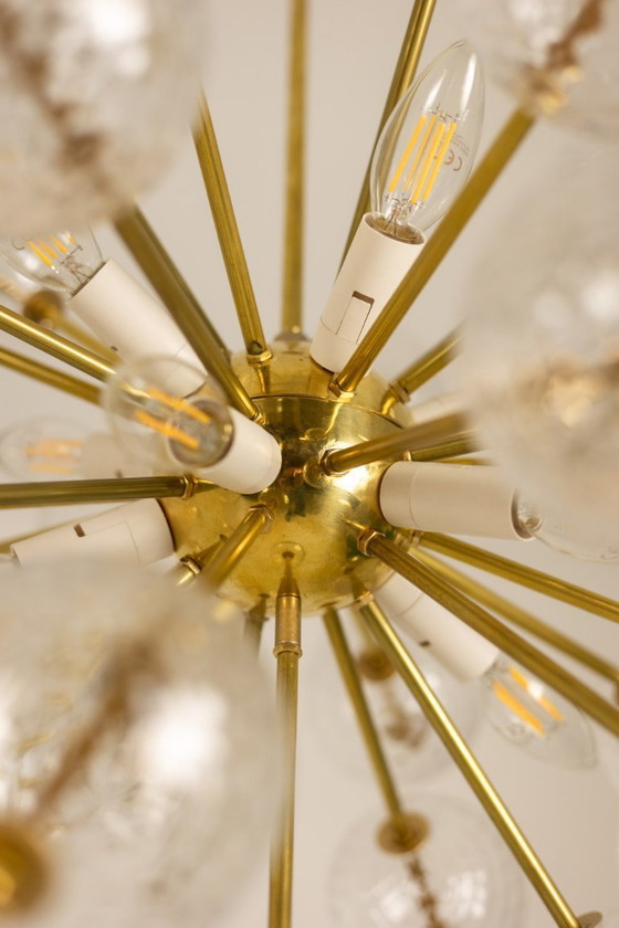 Image 1 of Kamenicky Senov, editor. Pair of brass and glass chandeliers. Circa 1970