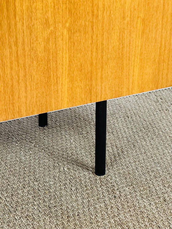 Image 1 of Minimalist Scandinavian sideboard in teak with black metal legs, 1960