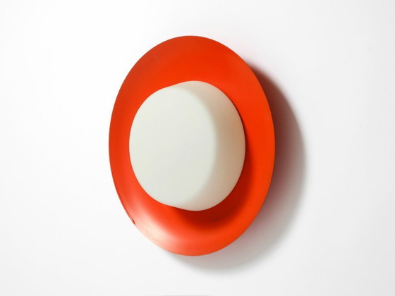 Image 1 of Grote Mid Century wand- of plafondlamp van glas met metalen reflector in rood van Kaiser Leuchten