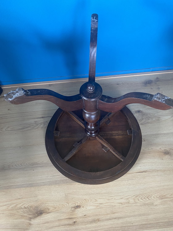 Image 1 of 1 Vintage round side/ wine table with leather top upholstery.