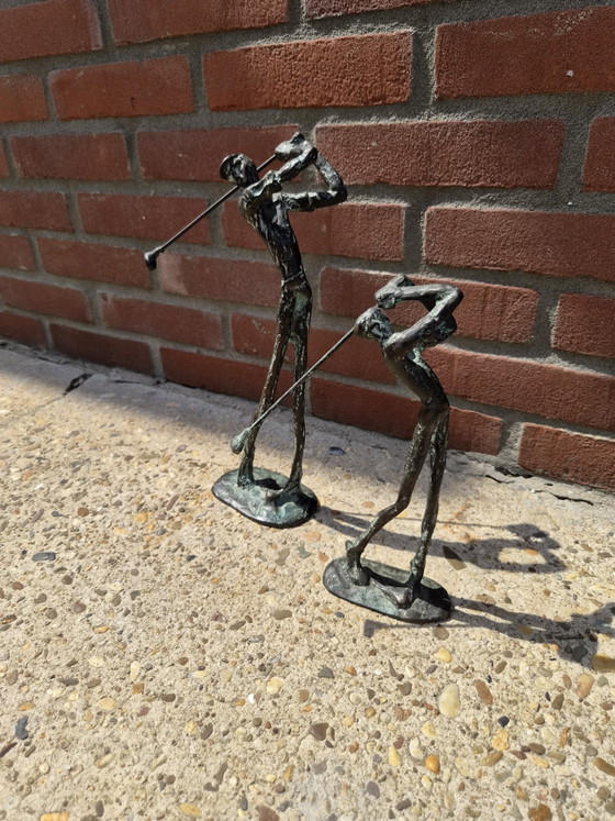Image 1 of 2 real bronze golfers