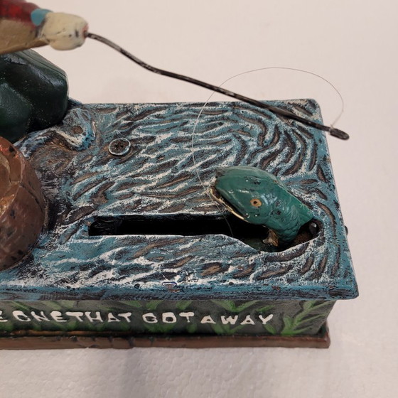 Image 1 of "Fisherman" piggy bank with fishing mechanism, cast iron, 1950s - USA.
