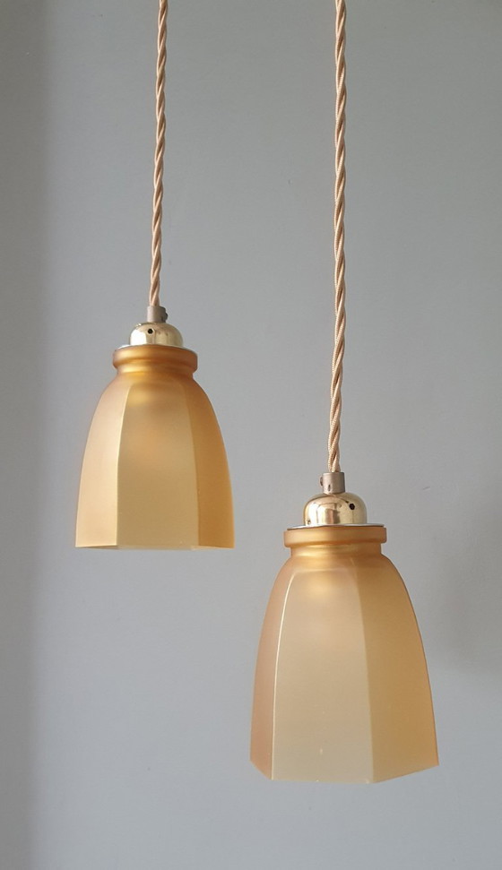 Image 1 of Set Vintage franse gele hanglampen van gekleurd glas.