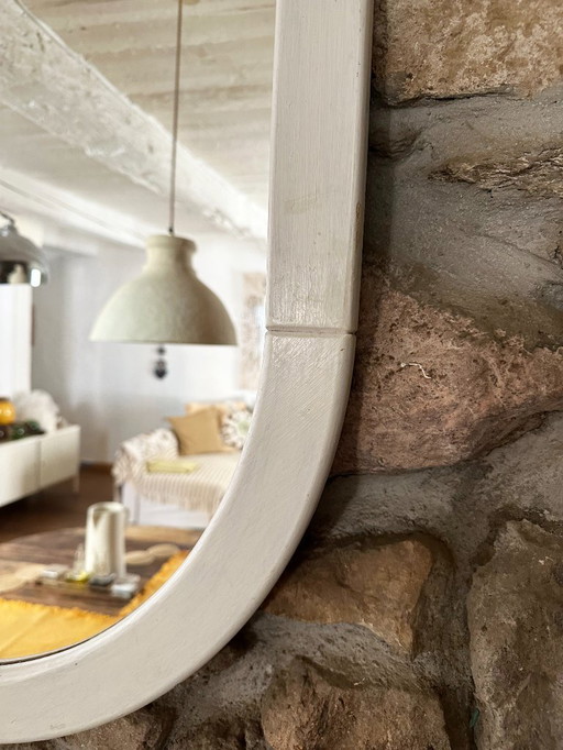 Large Space Age wall mirror in white-patinated wood. France, 1970s