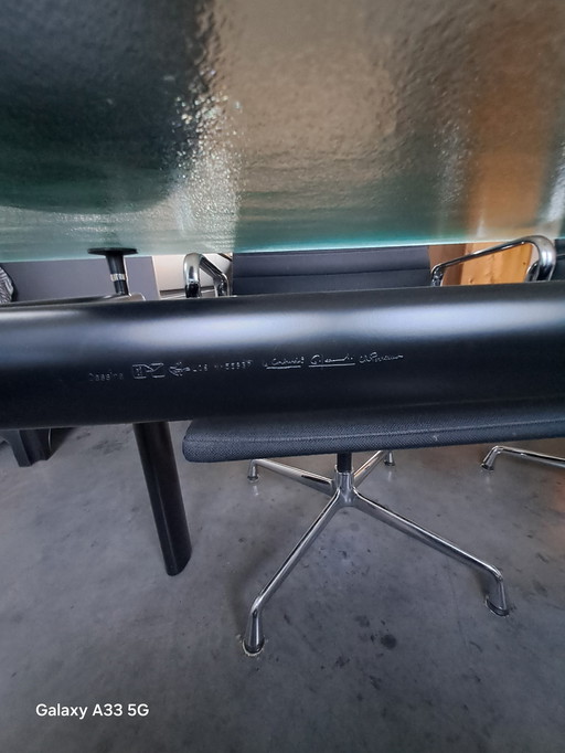 Beautiful combination of Cassina Le Corbusier table with frosted glass and 4 Vitra Eames chairs with black hupsakee upholstery 