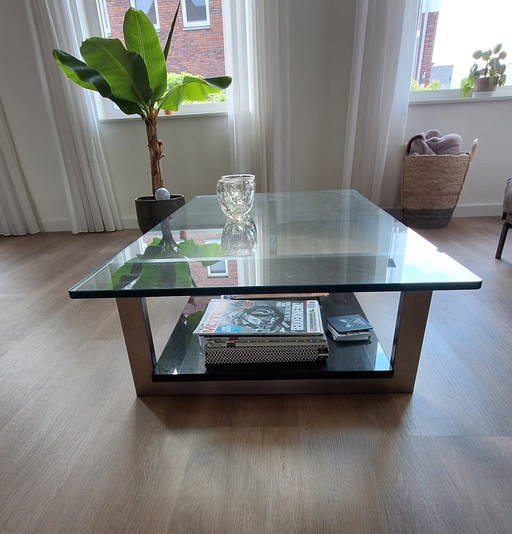 Design-Couchtisch, dicke Glasplatte mit abgerundeten Ecken, Granitsockel und Sockel aus Edelstahl
