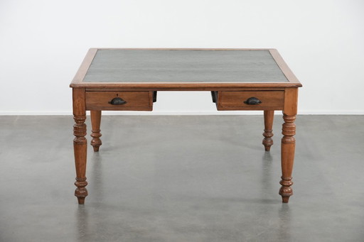 Antique writing table/partner desk with 4 drawers and a green leather top