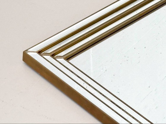 Image 1 of Wall mirror in a frame encased in beveled mirror glass